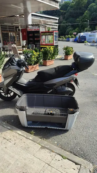 Large empty dog travel crate after bus station pickup in Istanbul