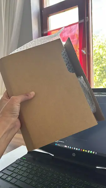 Daniel's iPad packed securely by Ana Kurye before FedEx international shipping