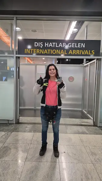Ozlem Boz at Sabiha Gokcen Airport international arrivals during the lost iPhone recovery operation